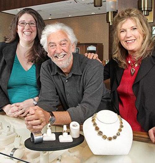 Family photo of Zoey, Chai, and Joy Man at jewelry counter