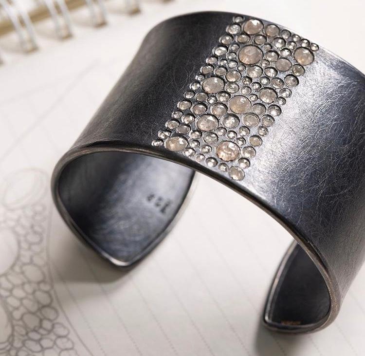 silver wide cuff bracelet with rose cut diamonds set in a square on top