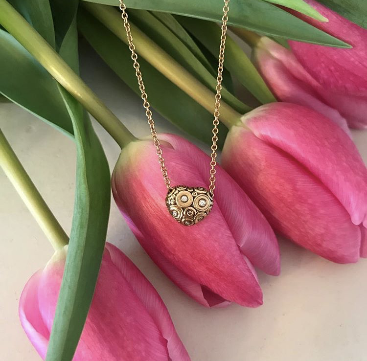 heart shape Alex Sepkus necklace on pink tulip