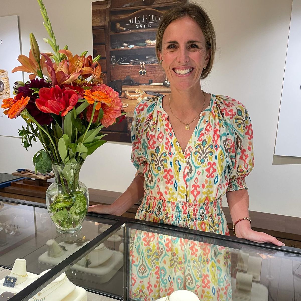 Photos of orange and yellow flowers next to a woman standing