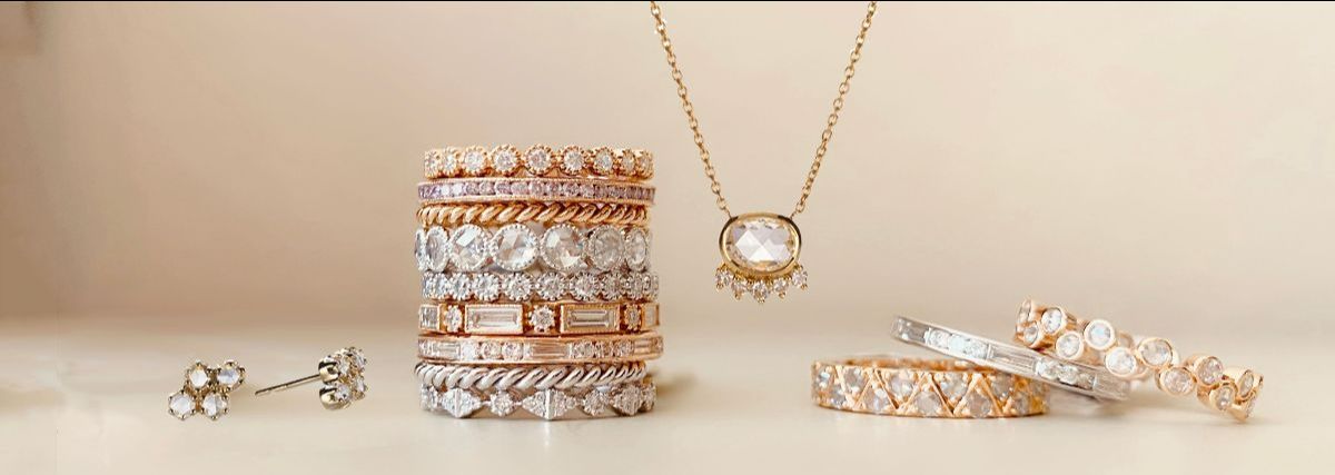 Sethi Couture stack of rings with jewelry surrounding it
