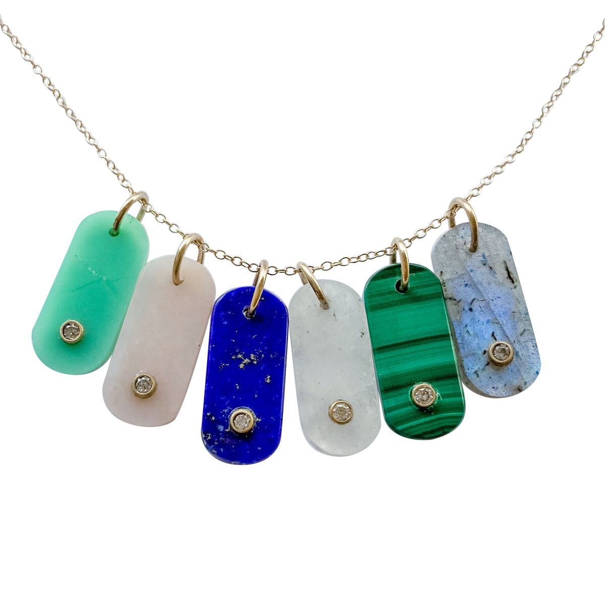 gemstone tabs with diamonds hanging on a chain