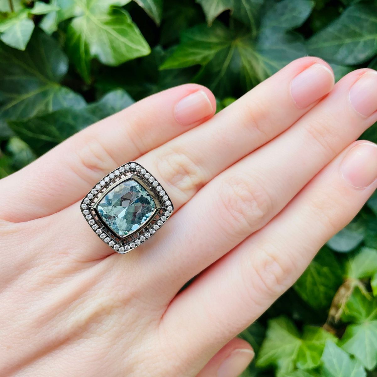 Link takes you to blackened white gold aquamarine and diamond ring.