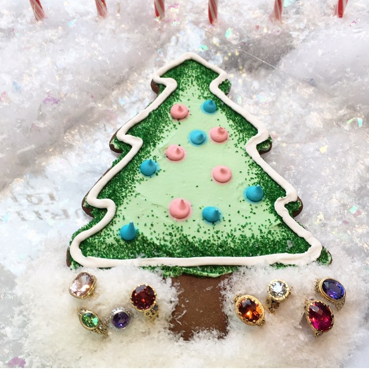 Christmas Tree cookie in snow with colorful rings underneath