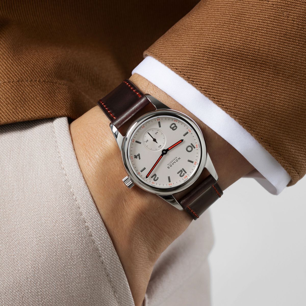 hand in pocket with stainless steel watch on wrist