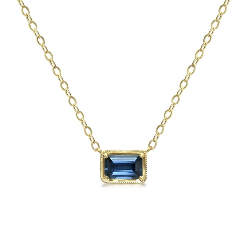 Blue and gold pendant with chain on white background