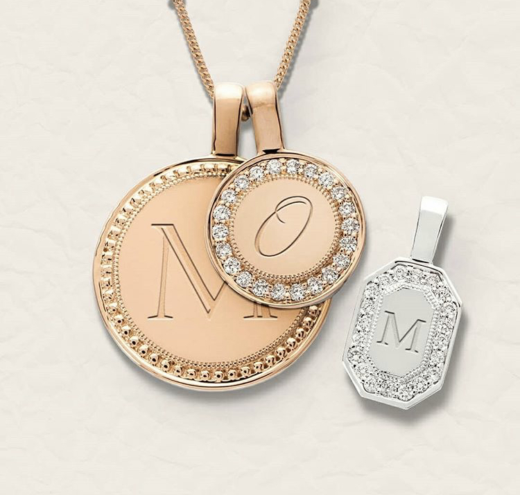 yellow and white gold charms with the letters "M" "O" "m"
