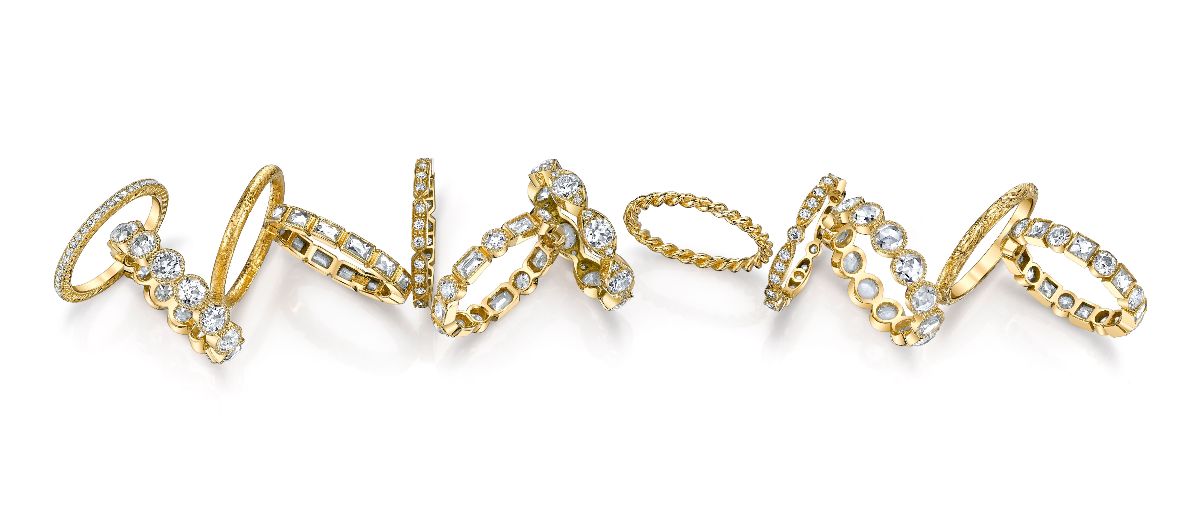 gold and diamonds rings on a white background