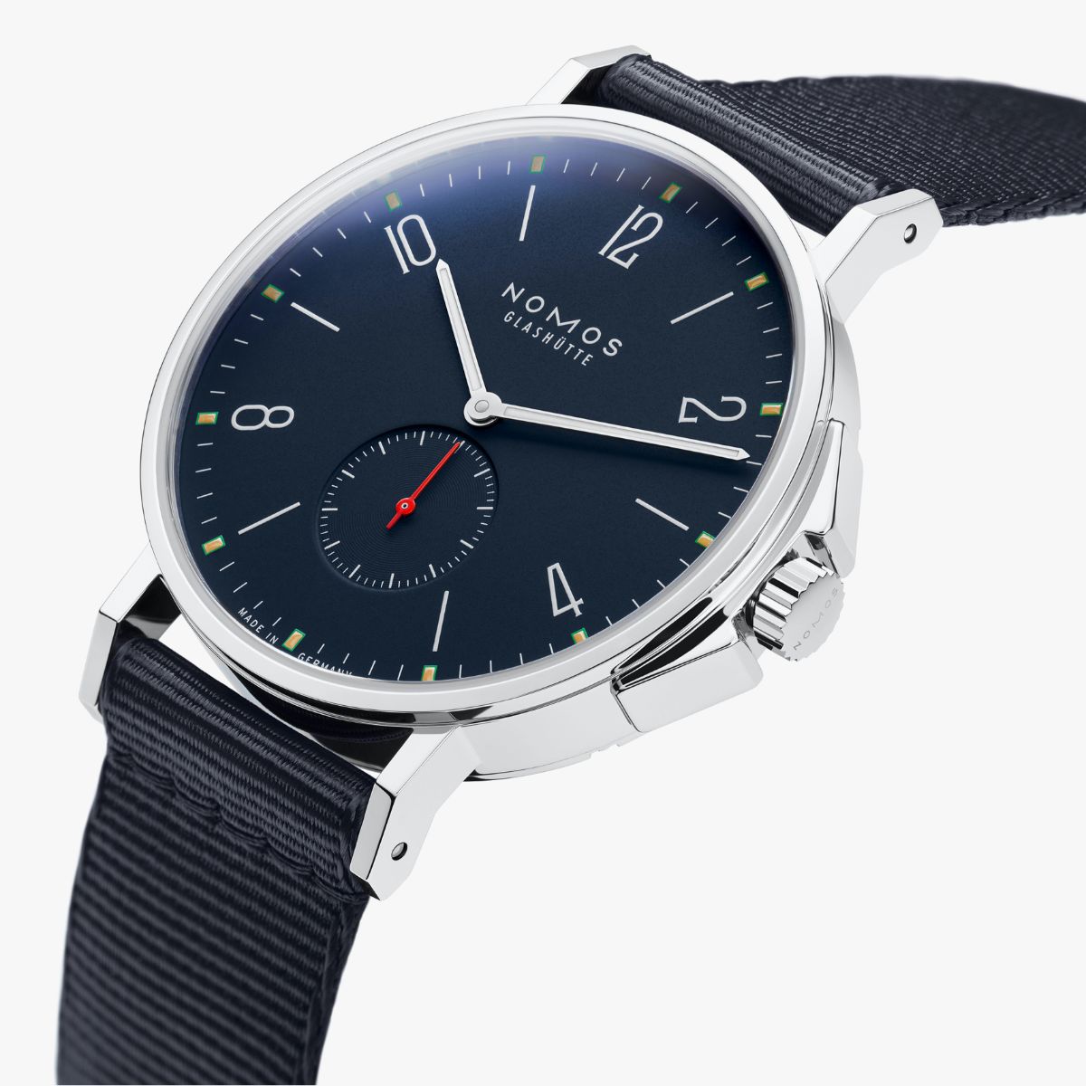 dark dial watch with nylon strap on white background