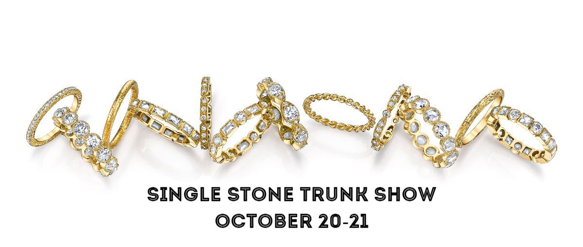 Yellow gold and white diamond rings scattered across the white image with the words "single stone trunk show october 20-21"