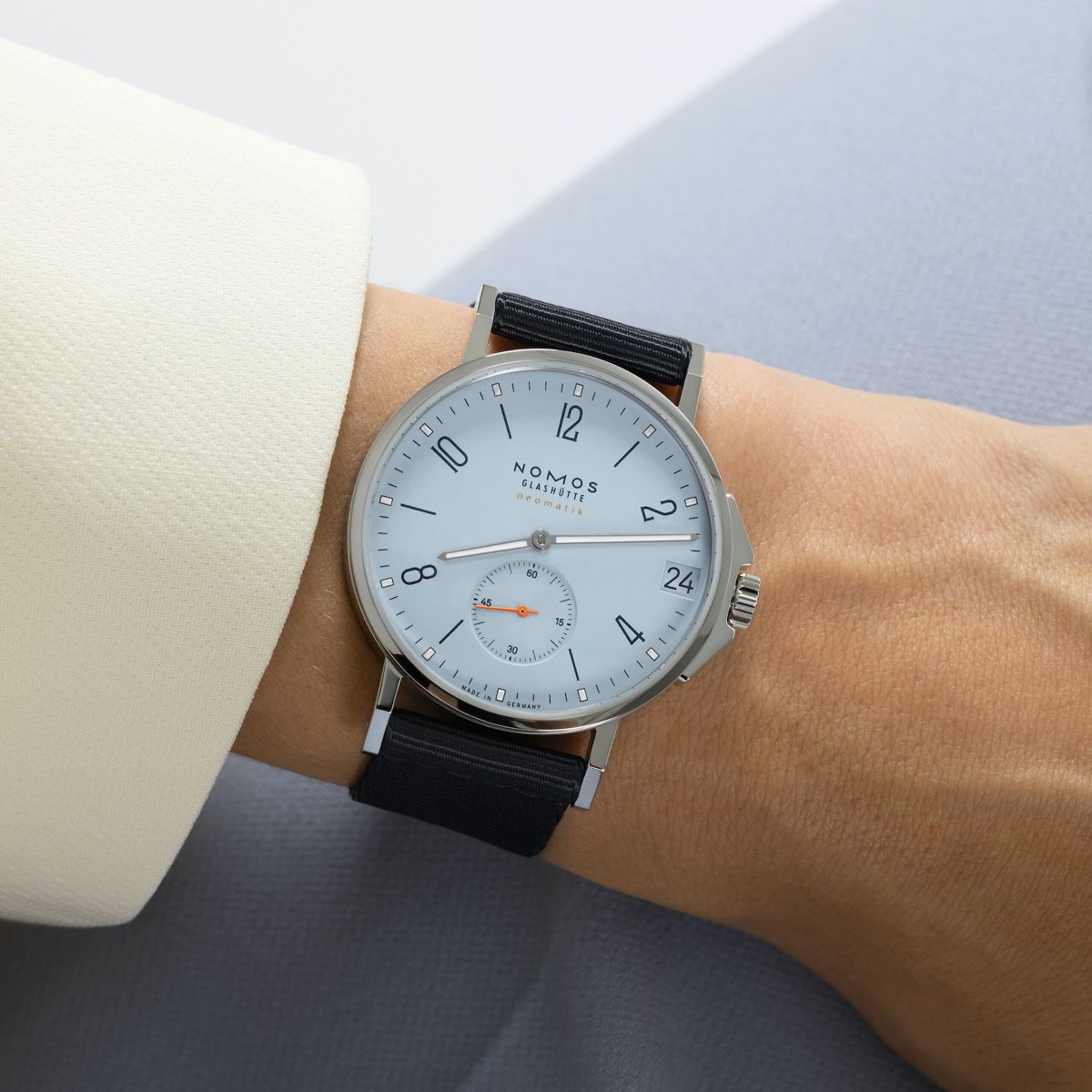 wrist photo of a sky blue Nomos Ahoi watch