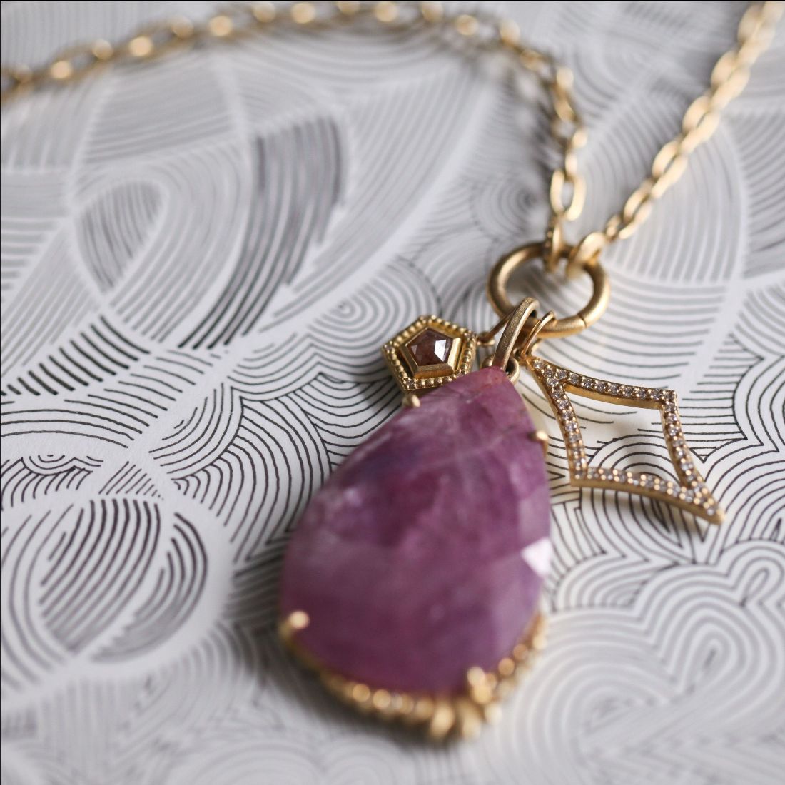 Samantha louise ruby necklace with hand drawn background