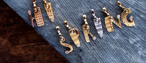 "Hi Spring" spelled out in multicolored pendants