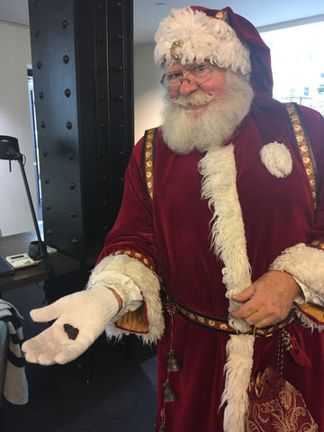 Santa with coal in his hand