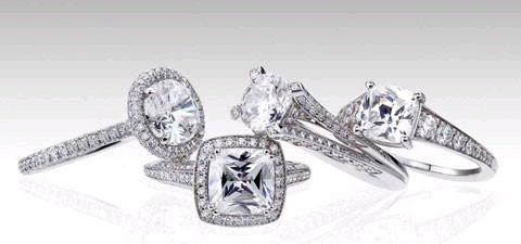 4 Mark Patterson bridal rings with diamonds stacked on each other