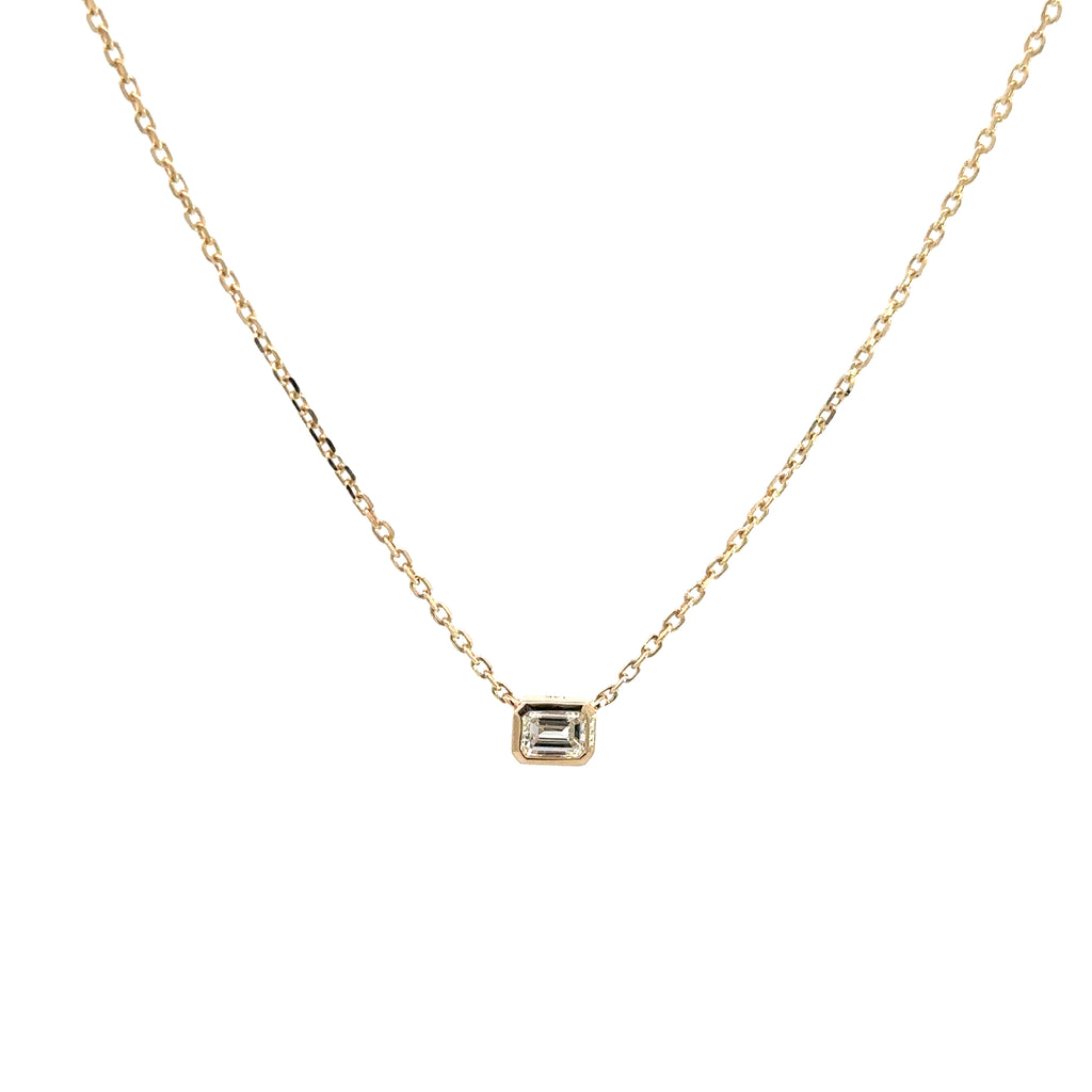front side of 14k yellow gold emerald cut bezel set diamond pendant necklace