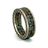 Todd Reed two row raw diamond cube band resting on it's side