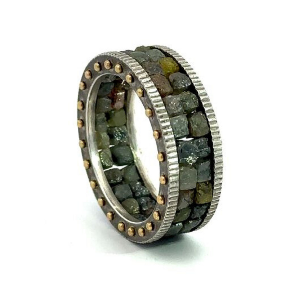 Todd Reed two row raw diamond cube band resting on it's side