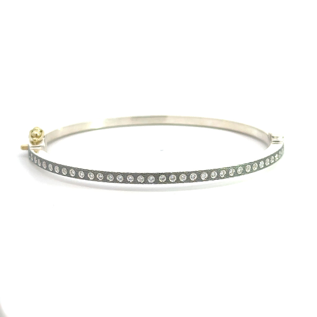 back side of Rene Escobar 18k yellow gold "Adam" diamond bangle bracelet with silver backside