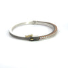side angle of Rene Escobar 18k rose gold "Chloe" diamond bangle bracelet with silver backside