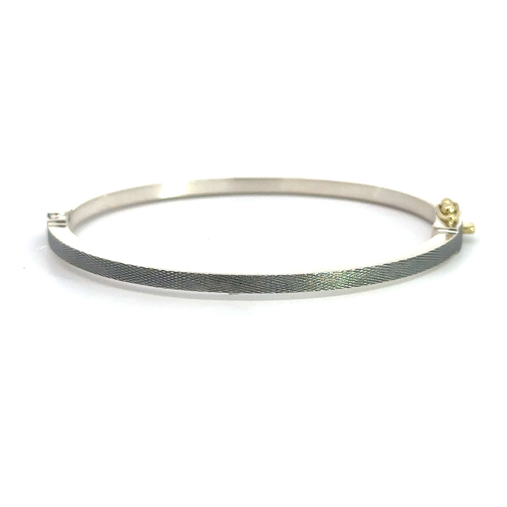 back side of Rene Escobar 18k rose gold "maru" diamond bangle bracelet with diamonds on front in groups of 3 and a silver back