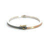 side angle of Rene Escobar 18k rose gold "maru" diamond bangle bracelet with diamonds on front in groups of 3 and a silver backside