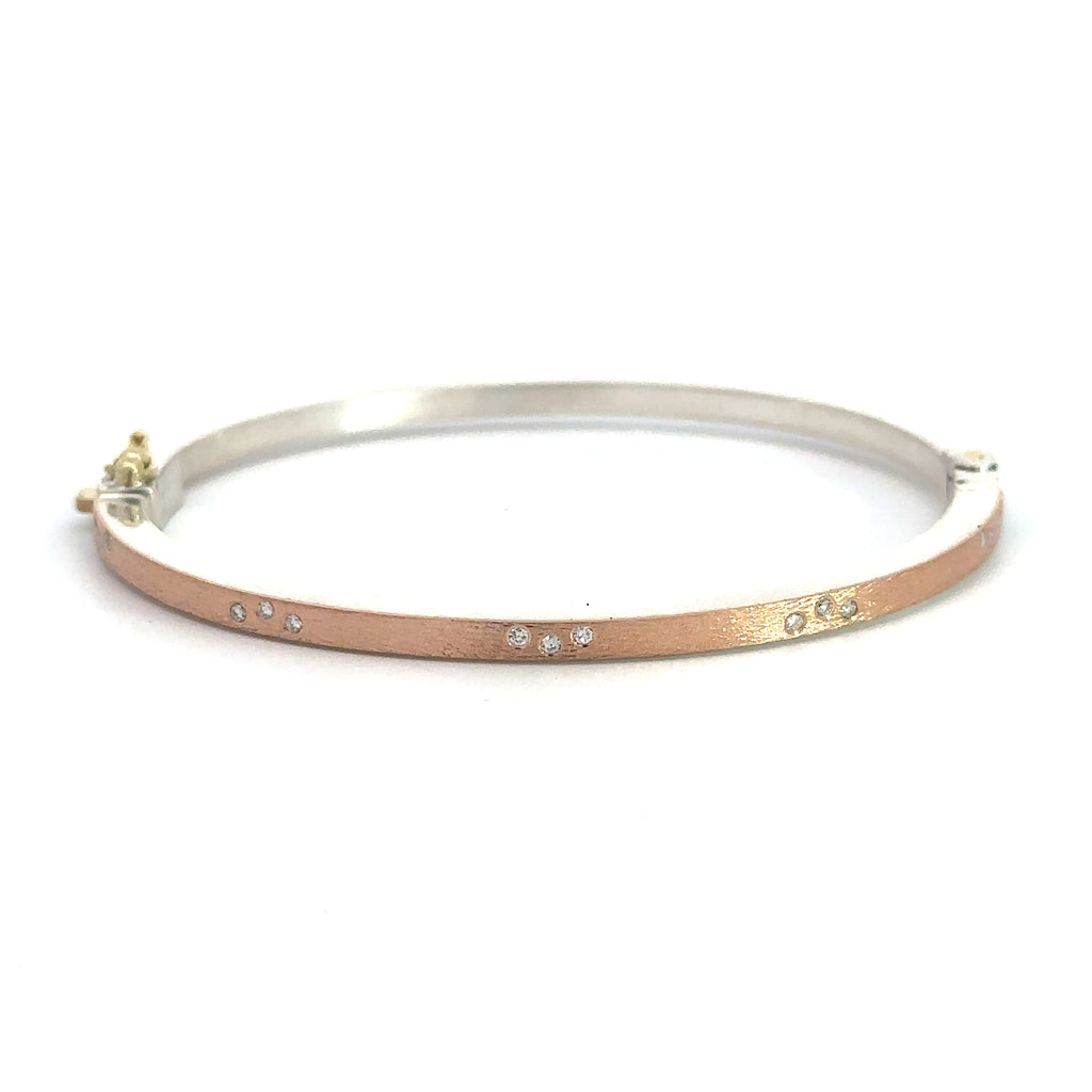Rene Escobar 18k rose gold "maru" diamond bangle bracelet with diamonds on front in groups of 3 and a silver backside