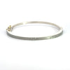 Rene Escobar 18k white gold "maru" diamond bangle bracelet with diamonds on front in groups of three