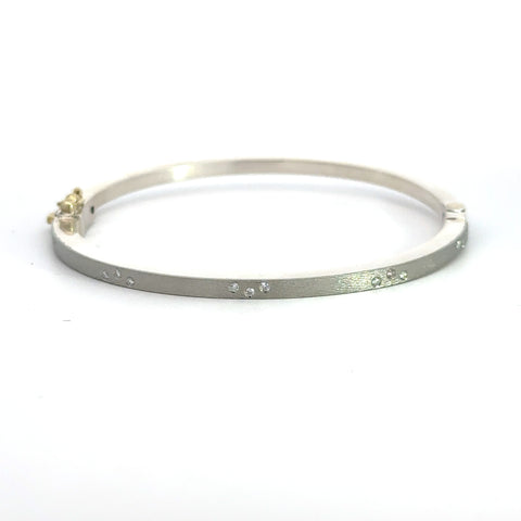 Rene Escobar 18k white gold "maru" diamond bangle bracelet with diamonds on front in groups of three