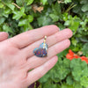 Alex Sepkus "Sticks and Stones" Yowah Opal Heart Pendant in hand