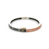 side angle of Rene Escobar 18K rose gold "carol" bangle bracelets with diamonds throughout and a silver backside