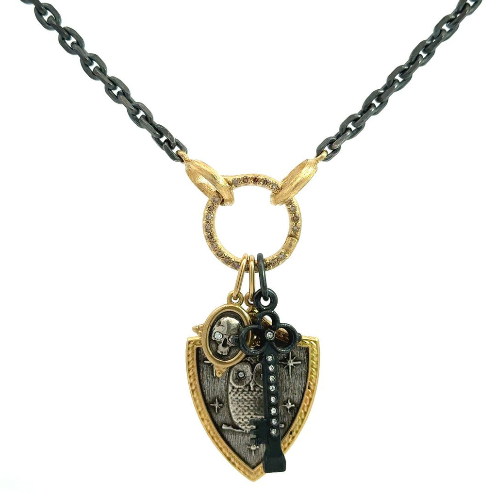 Erica Molinari 18K yellow gold large round champagne diamond charm holder shown on link chain holding charms. Chain and charms sold separately.