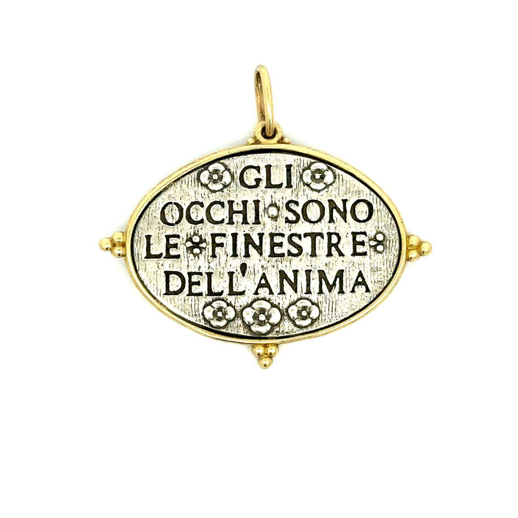 Erica Molinari sterling silver with 18k yellow gold rim charm back side with "the eyes are the window to the soul" inscribed in Italian and small flowers around the text.