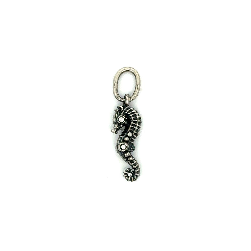 Erica Molinari sterling silver seahorse charm with three brilliant diamonds on each side.