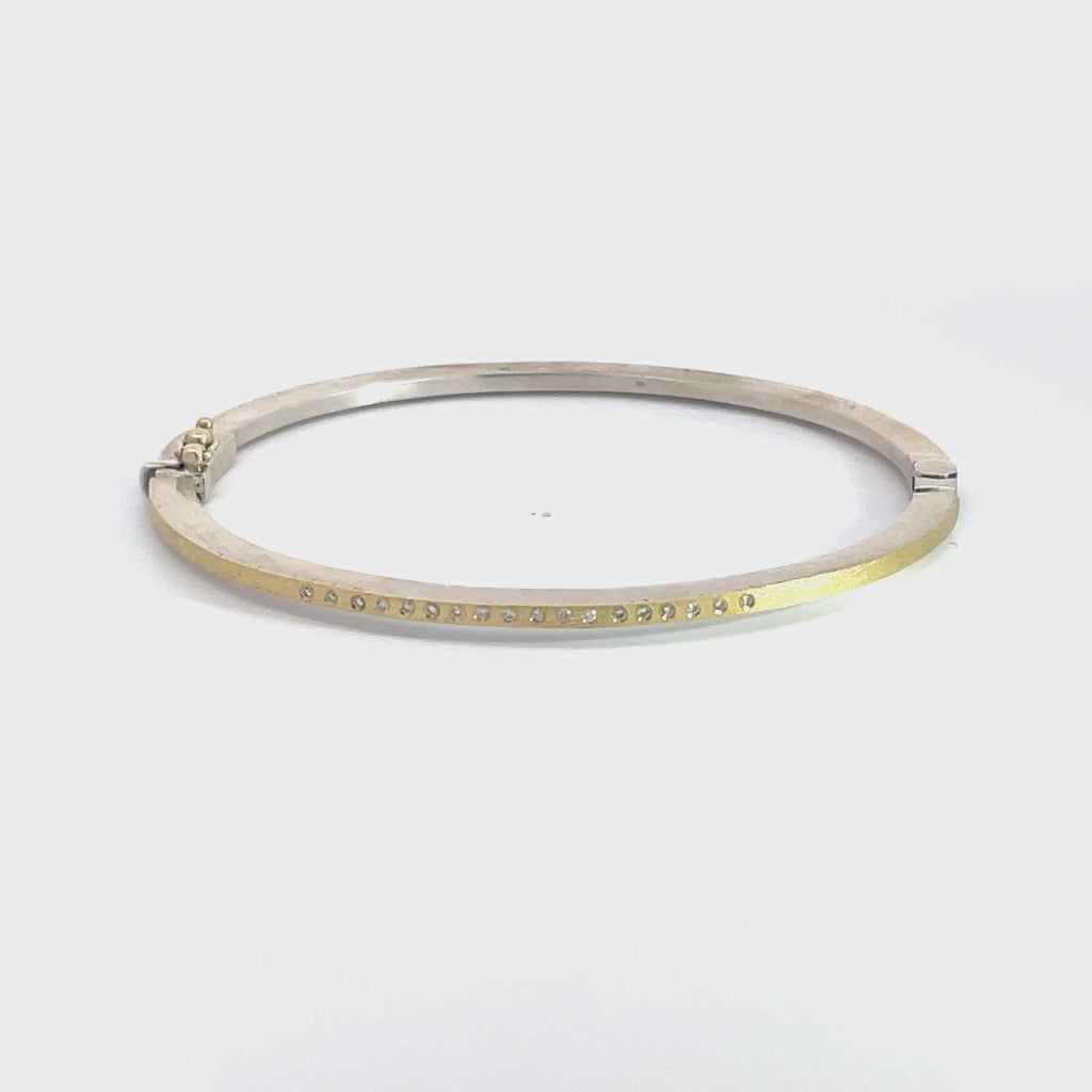 Rene Escobar 18K Yellow Gold "Laura" Diamond Bangle Bracelet video 360 spinning the product to show front and back of bracelet with diamonds on one side