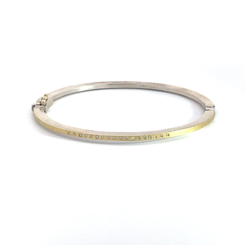 Rene Escobar 18K Yellow Gold and Sterling Silver "Laura" Diamond Bangle Bracelet featuring diamonds in a row on one side.