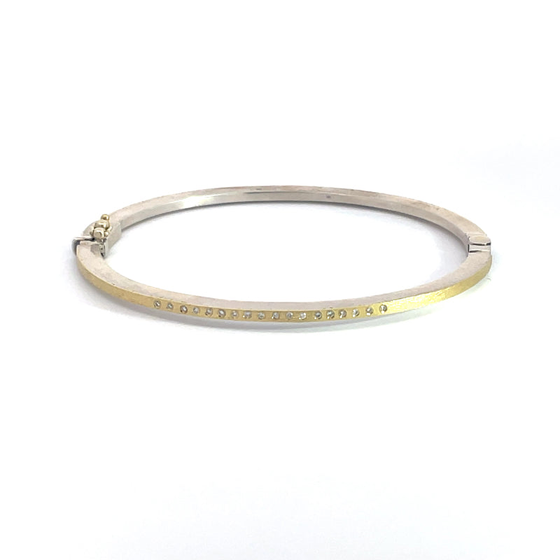 Rene Escobar 18K Yellow Gold and Sterling Silver "Laura" Diamond Bangle Bracelet featuring diamonds in a row on one side.