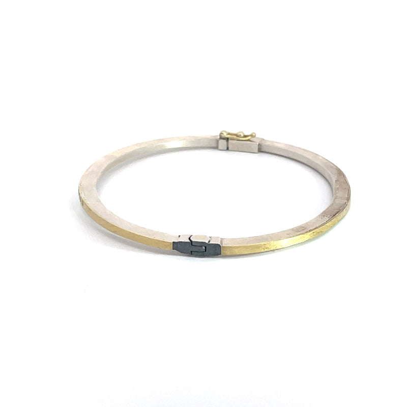 Rene Escobar 18K Yellow Gold "Laura" Diamond Bangle Bracelet side profile showing silver hinge next to the gold on the main part of the bracelet.