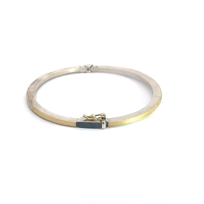 Rene Escobar 18K Yellow Gold and Sterling Silver "Laura" Diamond Bangle Bracelet side profile with clasp hinge mechanism highlighting the gold and silver metals.