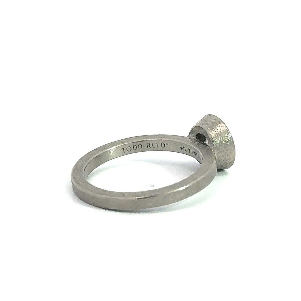 back side of Todd Reen palladium round light brown diamond halo ring showing the "Todd Reed" stamp inside the band