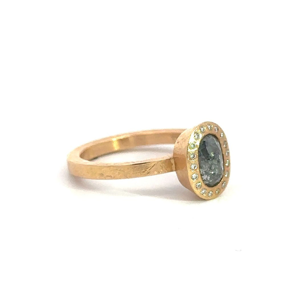 Todd Reed oval gray diamond and 18k rose gold ring, side angle of ring.