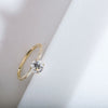 ILA round cut diamond ring in 18 K yellow gold with pave diamonds along the rim
