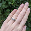 Princess Cut Diamond and 18K White Gold Channel Set Band ring on hand