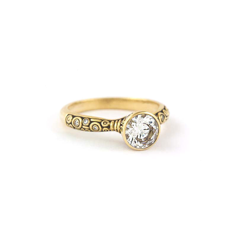 Alex Sepkus 18K yellow gold "Martini" ring with one 1.01 carat Hearts on Fire round brilliant cut diamond and 13 round bezel set accent diamonds (0.15ctw). 