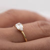 ILA East-West Pear Diamond Engagement Ring 18K Yellow Gold on hand