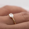 close-up of ILA East West pear cut diamond ring in 18 K yellow gold 