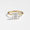 ILA East West engagement ring with large emerald cut diamond and smooth 18 K yellow gold band
