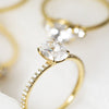 oval cut diamond ring in 18 K yellow gold with the band covered with pave diamonds