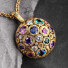 18K yellow gold "Blooming Hill" pendant with diamond and gemstone mix, dark background