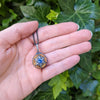 Arman Sarkisyan Sapphire and Diamond Poison Ball Locket in hand
